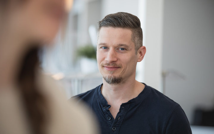 Dark-haired man looking at the camera